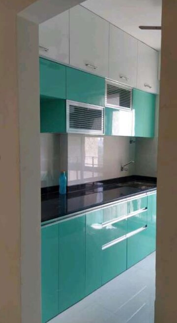 Kitchen in 2 BHK Apartment at Rustomjee Urbania Azziano, Majiwada – for Sale