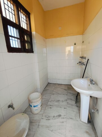 Bathroom in 1.5 BHK Apartment at Sunny Enclave – for Rent