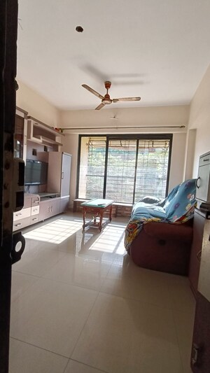 Living Room in 2 BHK Apartment at Parsik Nagar – for Sale