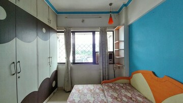 Bedroom in 2 BHK Apartment at Satellite Garden, Goregaon East – for Rent