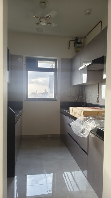 Kitchen in 2 BHK Apartment at Rajesh Raj Infinia, Malad West – for Rent