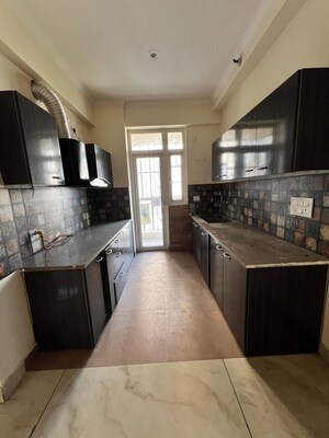 Kitchen in 2 BHK Apartment at Aims Golf City, Sector 75 – for Sale