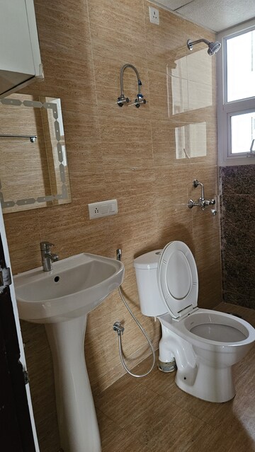 Bathroom in 3 BHK Apartment at Rishita Manhattan, Gomti Nagar – for Rent