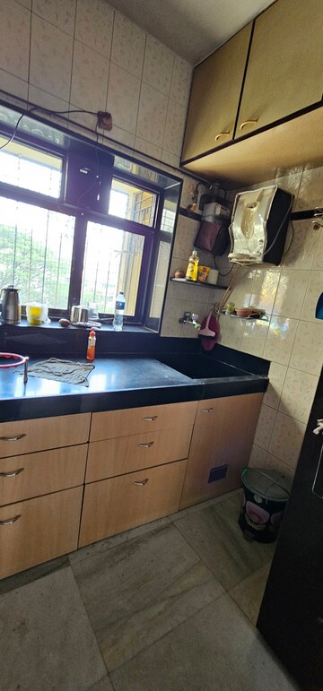 Kitchen in 2 BHK Apartment at Vikash Complex CHS, Thane West – for Sale