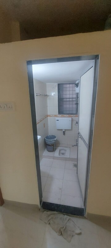 Bathroom in 2 BHK Apartment at Manisha Purti CHS, Goregaon West – for Rent