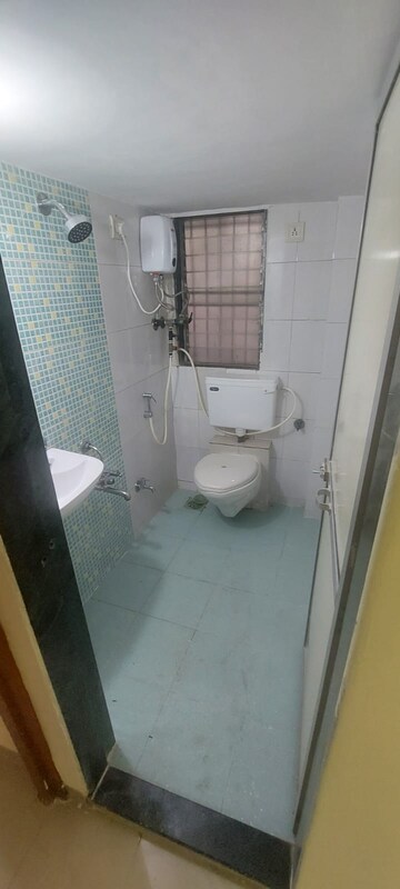 Bathroom in 2 BHK Apartment at Manisha Purti CHS, Goregaon West – for Rent