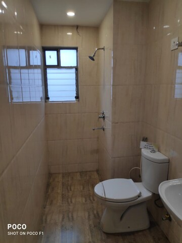 Bathroom in 3 BHK Apartment at Sureka Sunrise Aura, Dakshin Gobindopur – for Sale