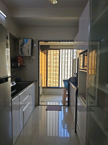 Kitchen in 2 BHK Apartment at Unique Shanti Skyline 2, Mira Road – for Sale