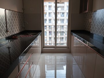 Kitchen in 2 BHK Apartment at Shree Tirupati STG Signature Residency, Patlipada – for Rent