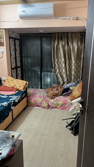 Bedroom in 1 BHK Apartment at JanKalyan CHS, Goregaon West – for Sale