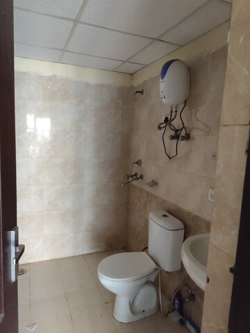 Bathroom in 2 BHK Apartment at Aims Golf City, Sector 75 – for Rent
