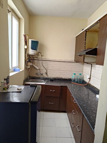 Kitchen in 2 BHK Apartment at Grah Avas Green View Heights, Raj Nagar Extension – for Rent