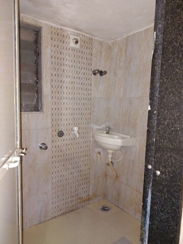 Bathroom in 1 BHK Apartment at MAAD Nakoda Heights, Nalasopara West – for Rent