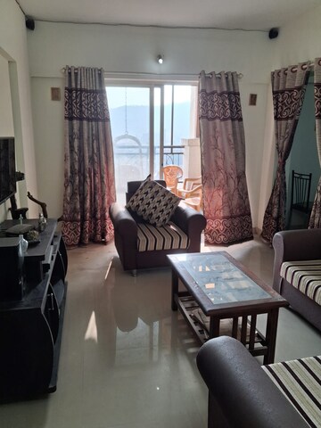 Living Room in 2 BHK Apartment at Windsor Maple Woodz, Wagholi – for Sale