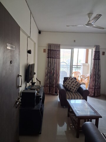 Living Room in 2 BHK Apartment at Windsor Maple Woodz, Wagholi – for Sale