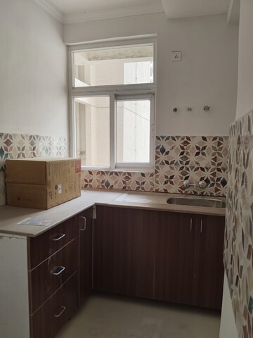 Kitchen in 2 BHK Apartment at Amrapali Leisure Park, Amrapali Leisure Valley – for Rent