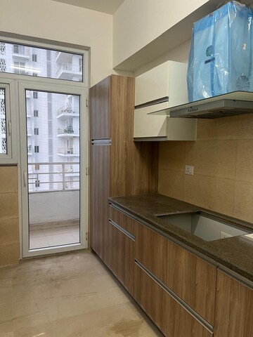 Kitchen in 2 BHK Apartment at Pivotal Riddhi Siddhi, Sector 77 – for Rent