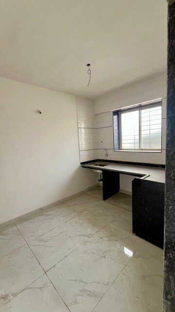 Kitchen in 2 BHK Apartment at Dhatrak Phata – for Sale