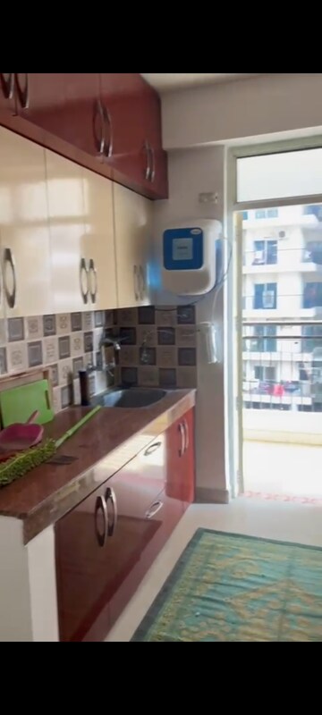 Kitchen in 3 BHK Apartment at Uninav Heights Phase I, Raj Nagar Extension – for Rent