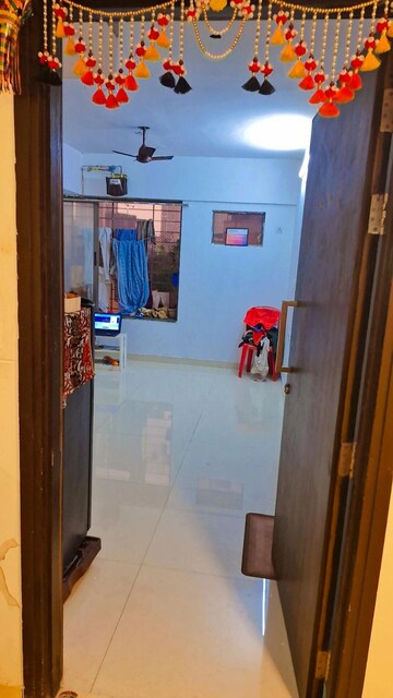 Living Room in 1 BHK Apartment at Lodha Crown Quality Homes, Majiwada – for Rent