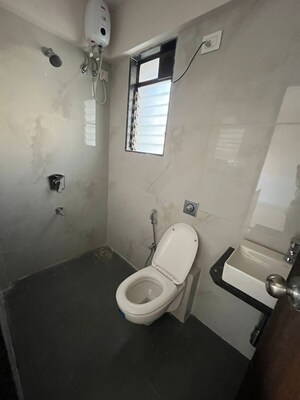 Bathroom in 2 BHK Apartment at Naman Habitat, Andheri West – for Sale