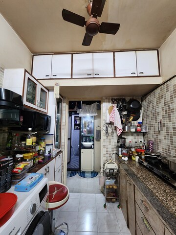 Kitchen in 2 BHK Apartment at Alica Nagar CHS, Kandivali East – for Sale