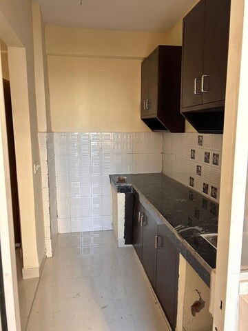 Kitchen in 2 BHK Apartment at Nilaya Greens, Raj Nagar Extension – for Rent