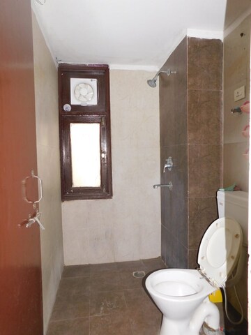 Bathroom in 3 BHK Apartment at Techman Moti Residency, Raj Nagar Extension – for Rent