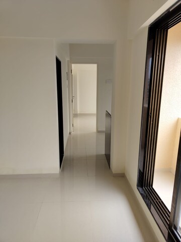 Building Lobby in 2 BHK Apartment at Pranjee Garden City, Katrap – for Rent