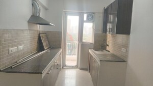 Kitchen in 3 BHK Apartment at Amrapali Crystal Homes, Sector 76 – for Sale