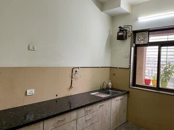 Kitchen in 3.5 BHK Apartment at Kalpataru Siddhachal Elite, Vasant Vihar – for Rent