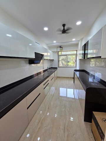 Kitchen in 3 BHK Apartment at Juhu Gulmohar CHS, Vile Parle West – for Rent