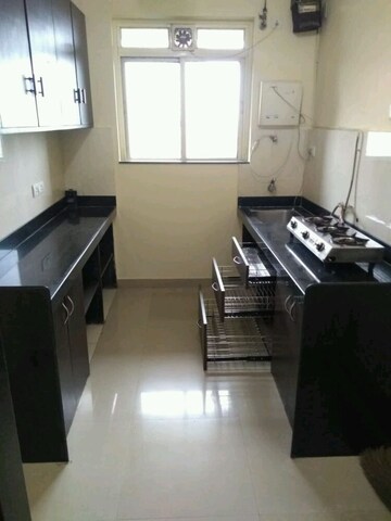 Kitchen in 2 BHK Apartment at Rustomjee Athena, Majiwada – for Rent