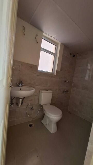 Bathroom in 2 BHK Apartment at Wave Dream Homes, Wave City – for Rent