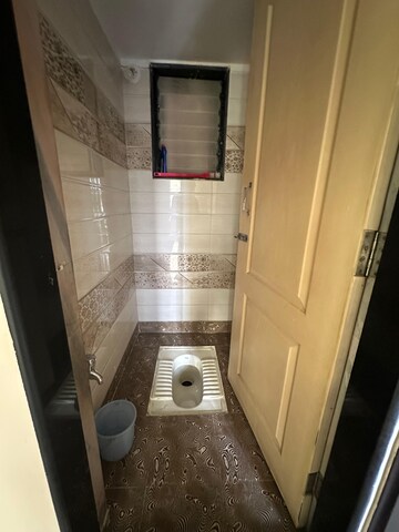 Bathroom in 1 BHK Apartment at Pranjee Garden City Phase 2, Katrap – for Rent