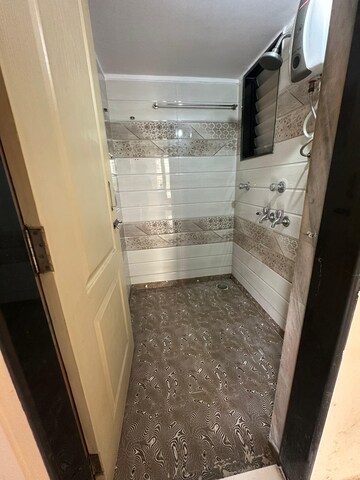 Bathroom in 1 BHK Apartment at Pranjee Garden City Phase 2, Katrap – for Rent
