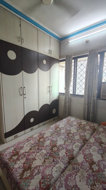 Bedroom in 2 BHK Apartment at Satellite Garden, Goregaon East – for Rent
