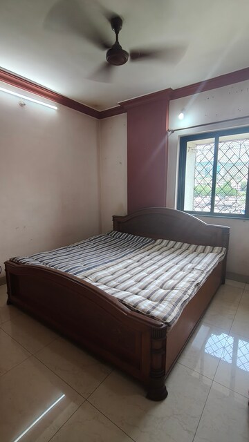 Bedroom in 2 BHK Apartment at Satellite Garden, Goregaon East – for Rent