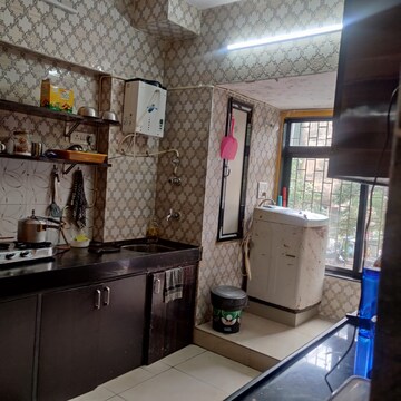 Kitchen in 2 BHK Apartment at Maharaja Retreat CHS, Goregaon East – for Rent