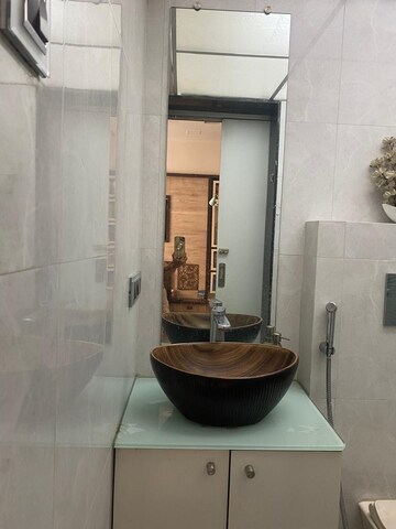 Bathroom in 2 BHK Apartment at Ravetkar Arihant Shree, Dahanukar Colony – for Rent
