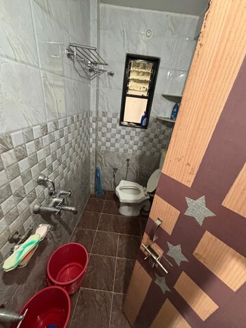 Bathroom in 2 BHK Apartment at Ravetkar Arihant Shree, Dahanukar Colony – for Rent