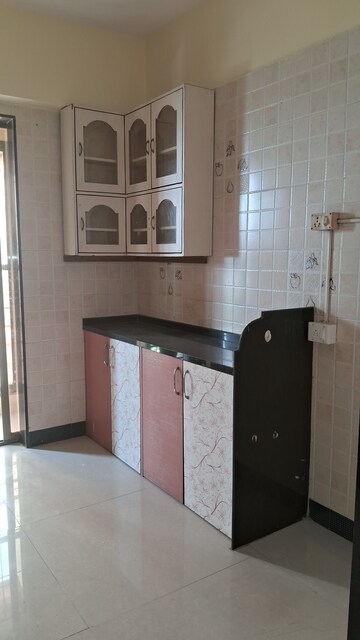 Kitchen in 2 BHK Apartment at New Central CHS, Beturkar Pada – for Rent
