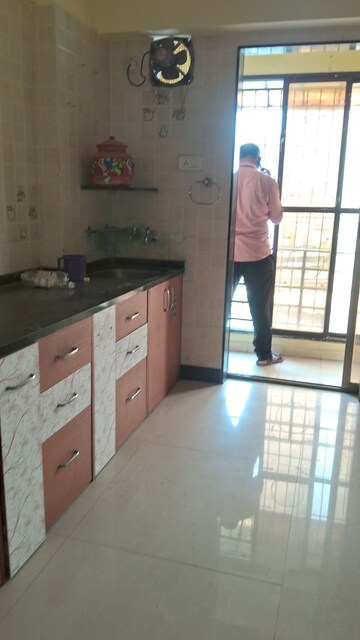 Kitchen in 2 BHK Apartment at New Central CHS, Beturkar Pada – for Rent