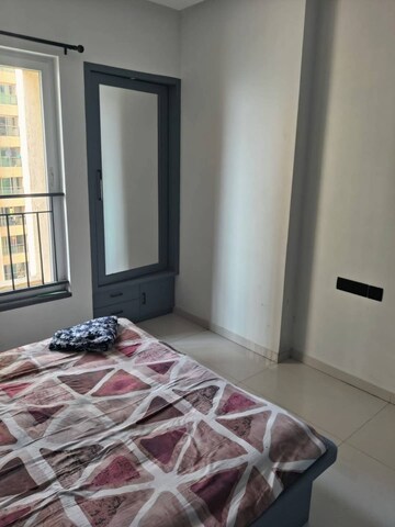 Bedroom in 2 BHK Apartment at Rustomjee Azziano Wing D, Majiwada – for Rent