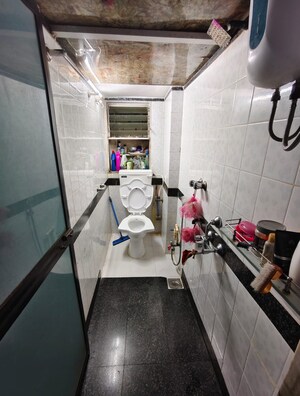 Kitchen in 2 BHK Apartment at Ani Anu Sri Balaji Enclave, Malad West – for Sale