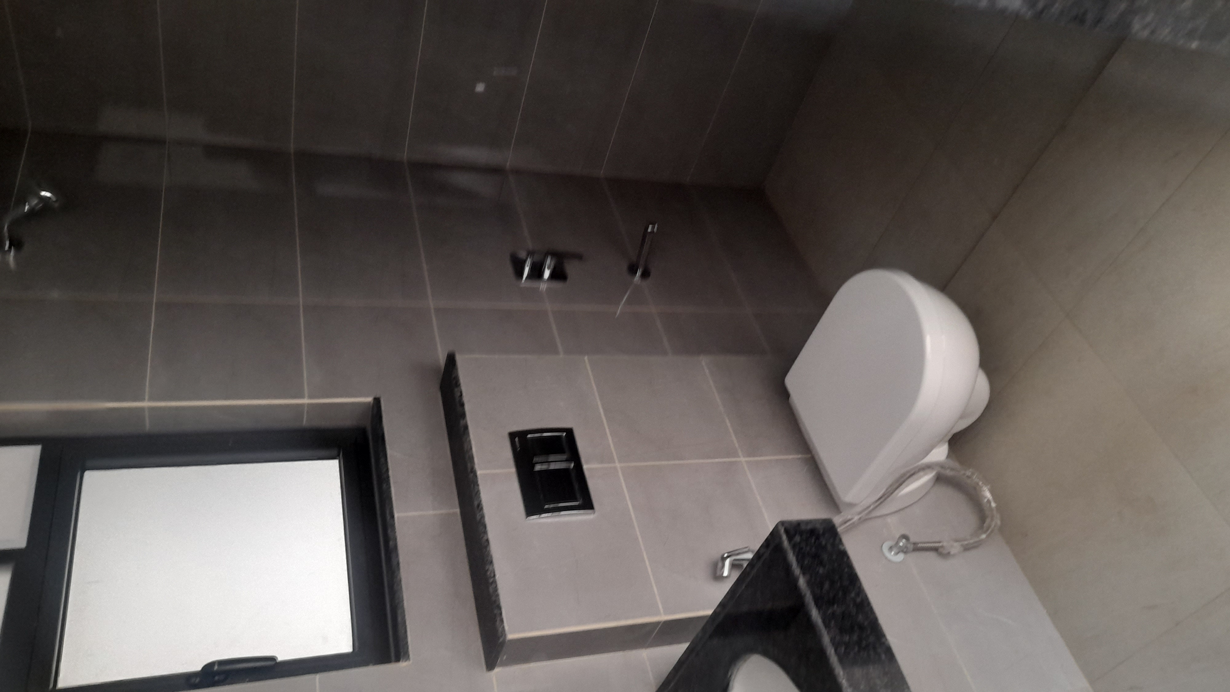 Bathroom in 2 BHK Apartment at Shapoorji Pallonji Sensorium, Hinjewadi – for Rent