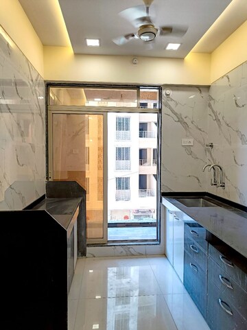 Kitchen in 1 BHK Apartment at Precious Empire, Pale Gaon – for Sale
