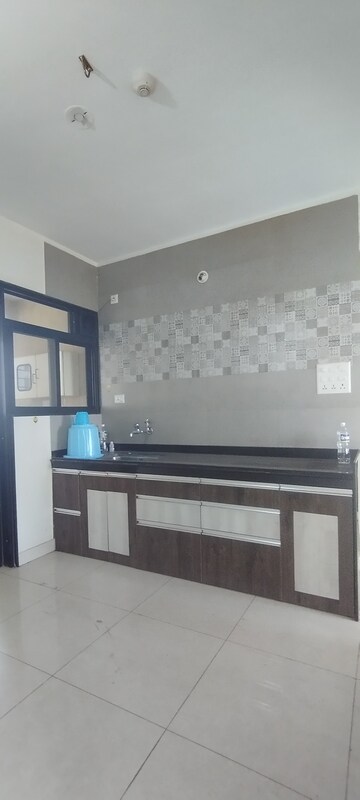 Kitchen in 2 BHK Apartment at Sargam CHS Nanded, Sinhagad Road – for Rent