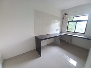 Kitchen in 2 BHK Apartment at Ojass Mai Kripa CHS, Louis Wadi – for Sale