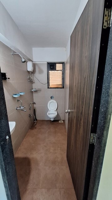 Bathroom in 2 BHK Apartment at Sai Baba Enclave, Goregaon West – for Rent